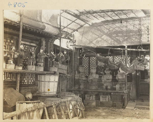 Shop interior showing ice lanterns and other figures