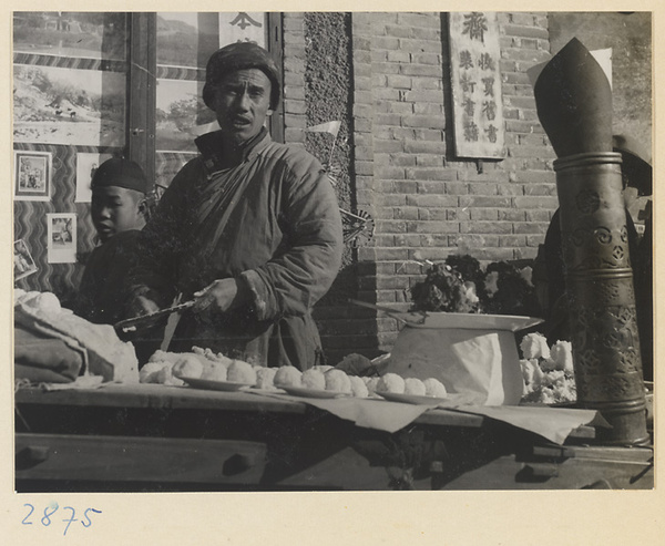 Street vendor selling food at a food stand at New Year's