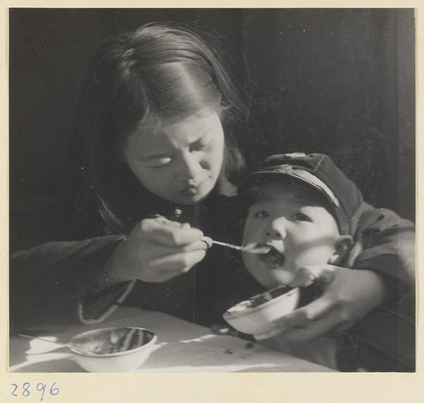 Woman feeding a child at New Year's