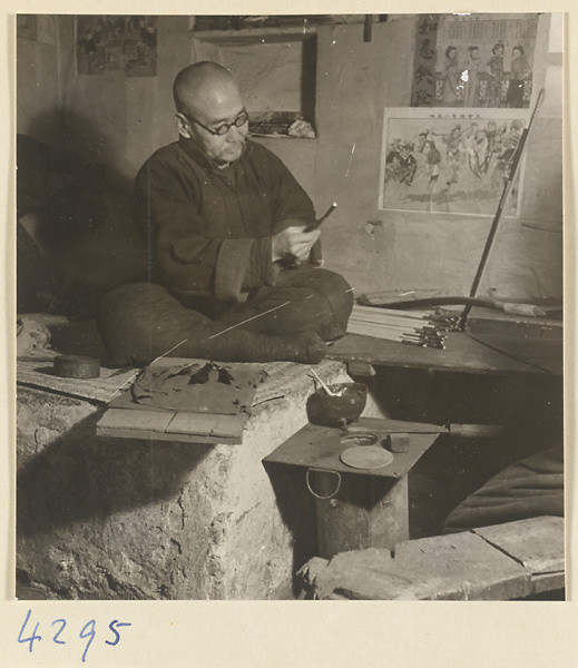 Man making an arrow in a bow-and-arrow-making shop