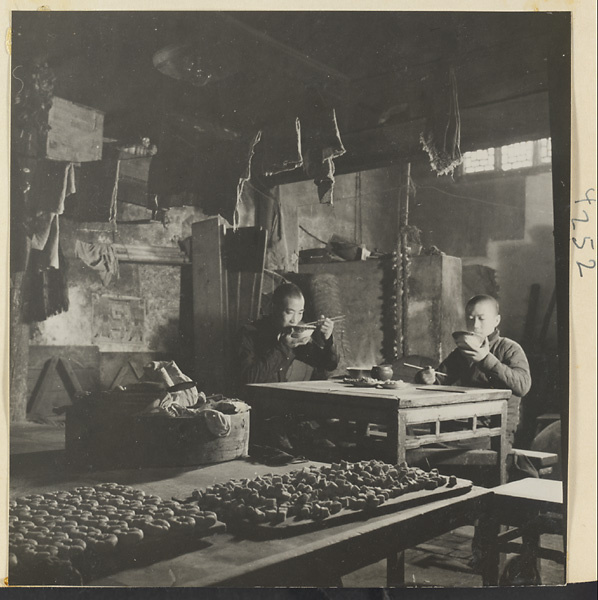 Bakery workers eating a meal in a bakery