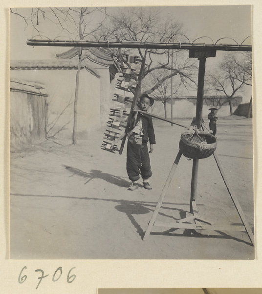 Boys spinning silk outdoors