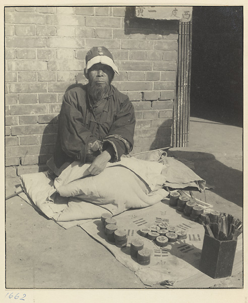 Itinerant fortune-teller with his divination tools