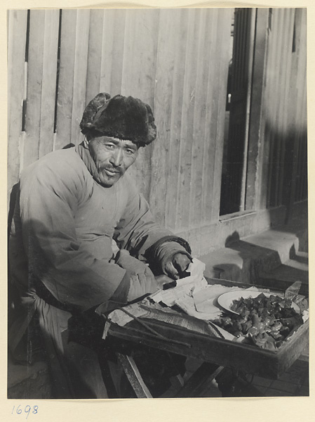 Food vendor selling food from a stand