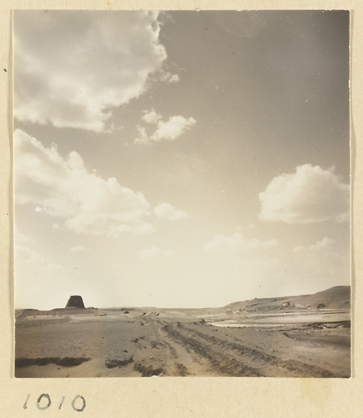 Road and landscape view of the plateau above the Yun'gang Caves with the adobe tower in the background