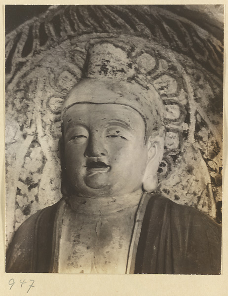 Detail showing the head of a statue of Buddha at the Yun'gang Caves