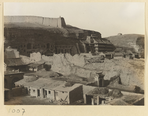 General view of the east end of Wuzhou Cliff showing the Spirit Wall, entrances to Caves 5-13, and temple facades