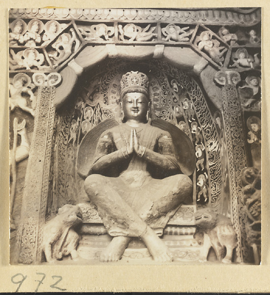 Interior detail of a cave temple at Yun'gang showing a niche with a seated Bodhisattva