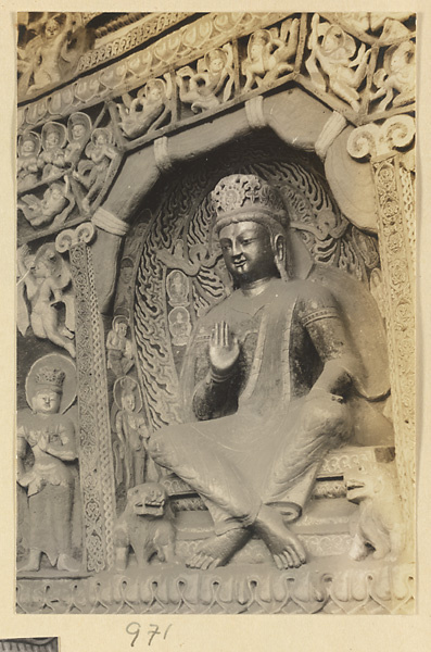 Interior detail of a cave temple at Yun'gang showing a niche with a seated Bodhisattva