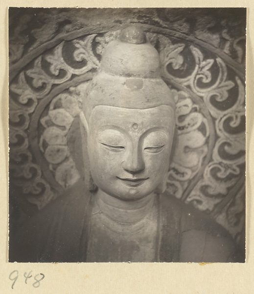 Detail showing the head of a statue of Buddha at the Yun'gang Caves