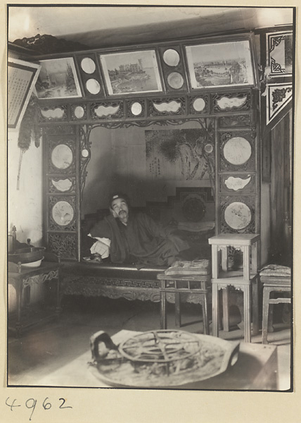 Priest reclining on a kang in a Daoist monastery on Hua Mountain