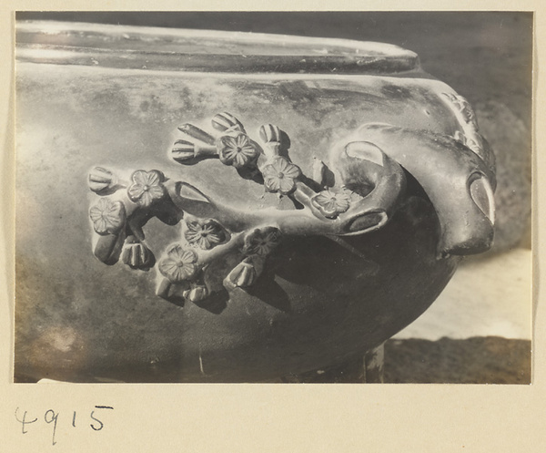 Detail of a tripod vessel with prunus flower motif at a Daoist monastery on Hua Mountain