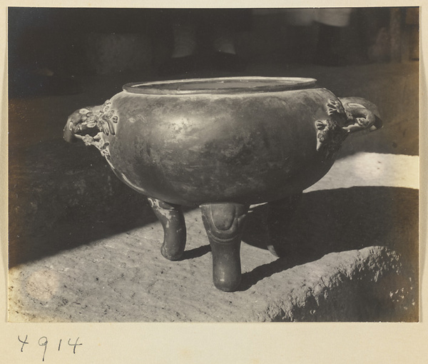 Tripod vessel with prunus flower motif at a Daoist monastery on Hua Mountain