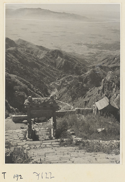 Trail with arch on Tai Mountain and view of the river valley below