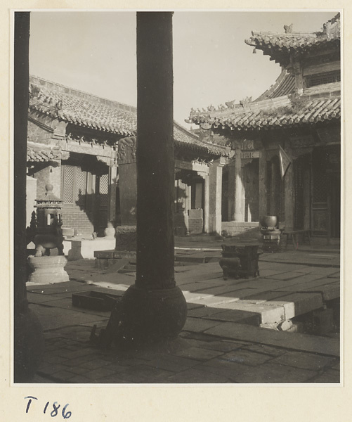 Temple courtyard on Tai Mountain showing memorial stela and incense burners