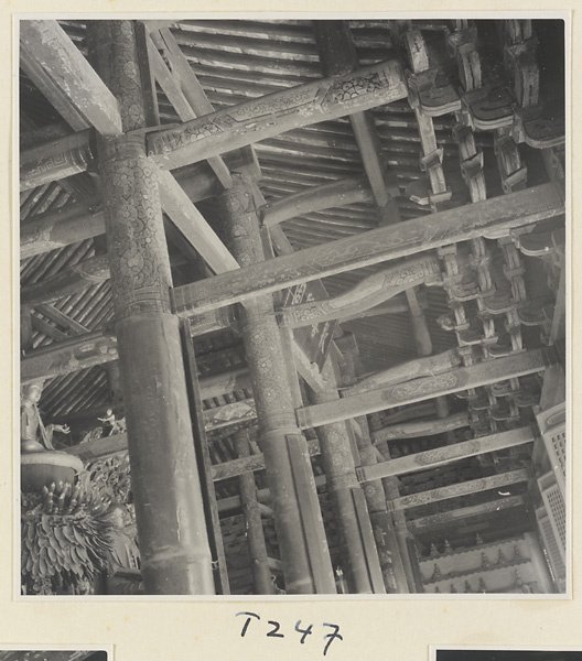 Interior of a temple building at Ling yan si showing altar detail, columns, beams, and ceiling