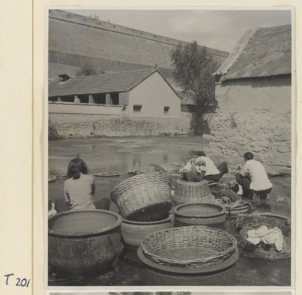 Village women washing clothes in the river at Ji'nan