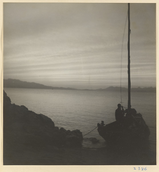 Boat tied to rocks on the Shandong coast