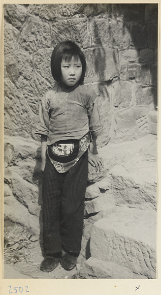 Girl wearing an embroidered purse on the Shandong coast