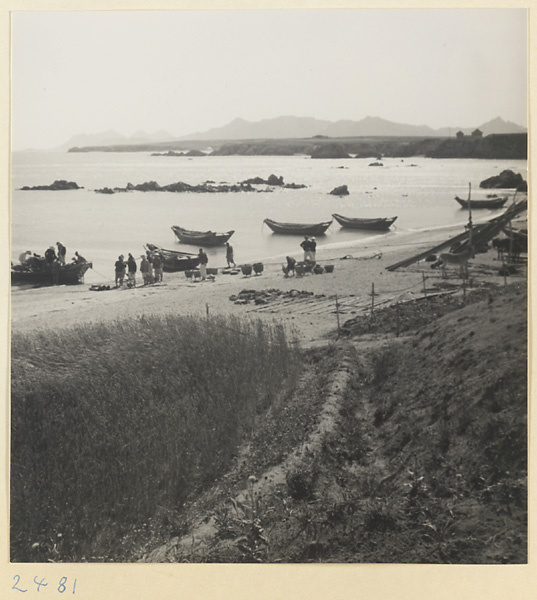 Fishermen on shore with baskets on the Shandong coast