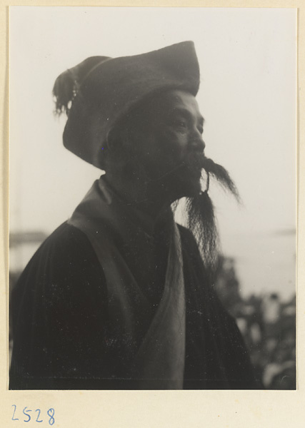 Actor at a market fair during the Dragon Boat Festival in a village on the Shandong coast