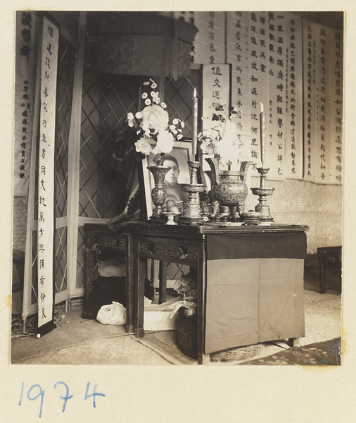 Funeral altar with photograph of the deceased and hanging scrolls with elegaic couplets