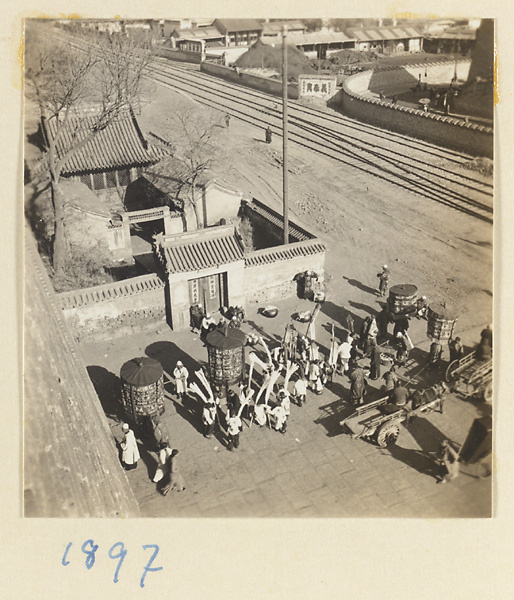 Funeral procession with umbrellas