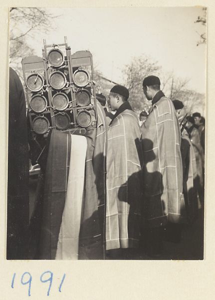 Buddhist monks with yun luo in a funeral procession