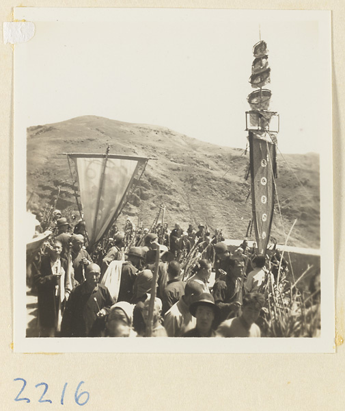 Temple society members performing a flagpole balancing show called zhong fan hui for pilgrims on Miaofeng Mountain