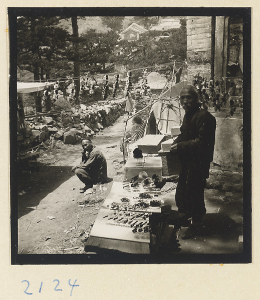 Man selling souvenirs on Miaofeng Mountain