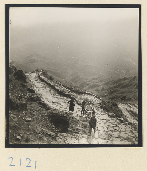 Pilgrim being carried up Miaofeng Mountain in a sedan chair