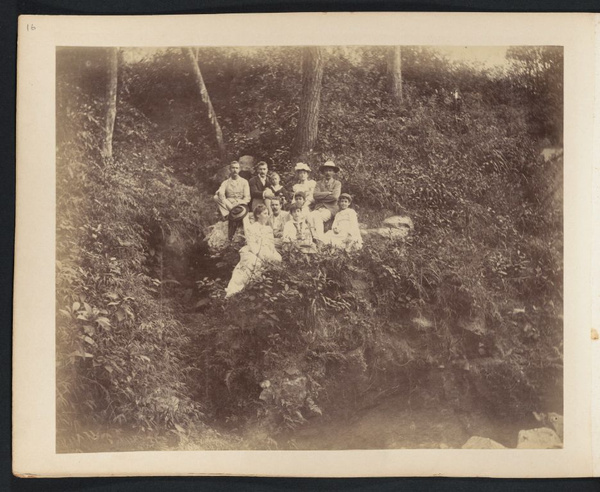 Anna Drew (front row, left) with daughters Dora and Lucy and group of unidentified people on wooded hillside, somewhere near Canton