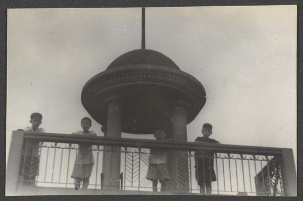 Boys looking down from minaret