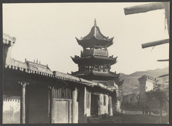 Tsapa, Tsinghai. A custom station for the suppression of salt smuggling into Tibet. A southern view of mosque minaret. Typical houses with flat roofs in foreground.