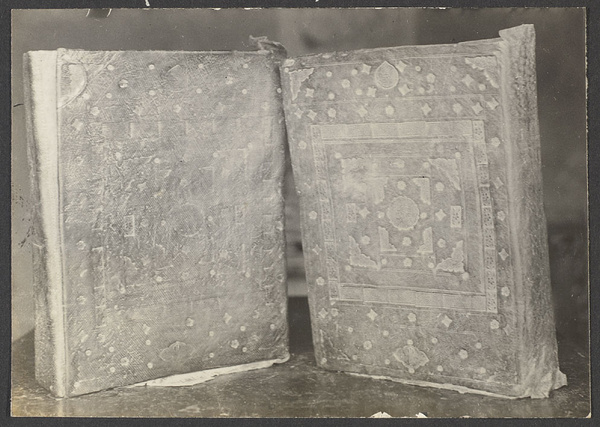 Kehtsikung, Tsinghai. Koran brought by Salars from Samarkand in 1371. Vol. I on left in Russian leather binding. Vol. II in ordinary cowhide.