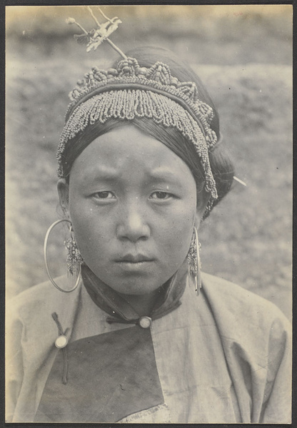 Aboriginal girl from Kuanting. These folks of the same race and language as the Tung Hsiang Moslems. Both are of Mongol origin.