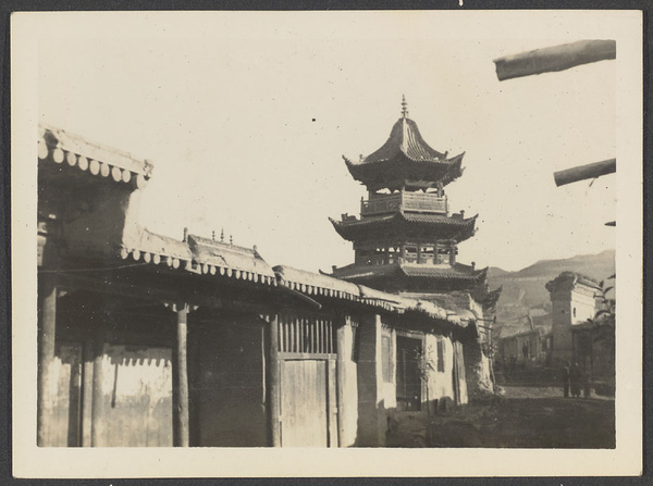 Tsapa, Tsinghai. A custom station for the suppression of salt smuggling into Tibet. A southern view of mosque minaret. Typical houses with flat roofs in foreground.