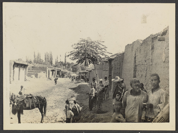 Tang Wan Ch'uan.  The main street.  Sign of our inn at top right.  Our innkeeper with the beard.