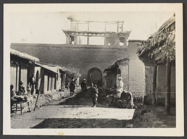 Sining, the official port to northern Tibet.  North Gate.  Mr. Harris & Dr. Z. out for a stroll.