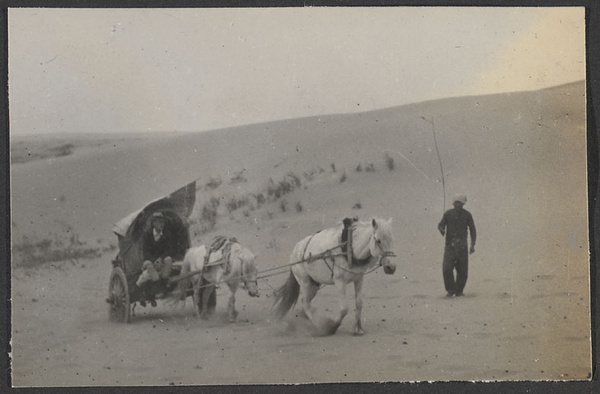 Crossing an arm of the Gobi, the Alashan Desert. We take turns riding.