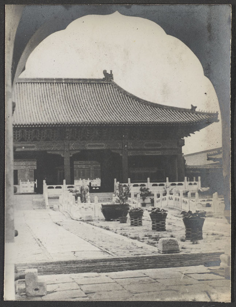 Forbidden City.  View of marble bridge and gate through archway.