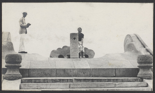 Summer Palace.  Man and woman on the Marble Boat.