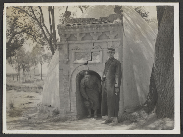 Hung Lo Fu, home of Ma Tsen-wu, & Pan Ch'iao, home of Ma Chin-hsi. Unidentified person (left) coming out of a beehive kumpei and Rev. Claude L. Pickens, Jr. (right).