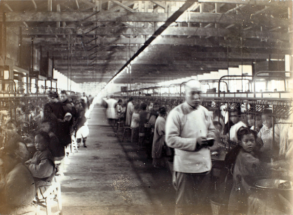 Children working in a silk filature (spinning mill/factory), possibly at Arnhold, Karberg & Co., Shanghai