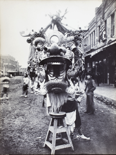 Dragon costume, standing at rest outside the Garnier Building, Old Chinatown, Los Angeles, USA
