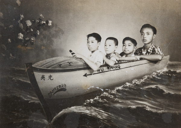 Studio portrait of four boys in a 'boat', Shanghai