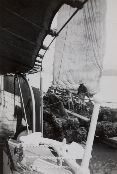 Poling a junk up the Yangtze River, past a steamship