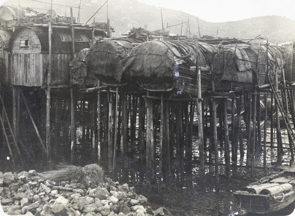 Sampans converted into riverside dwellings on stilts