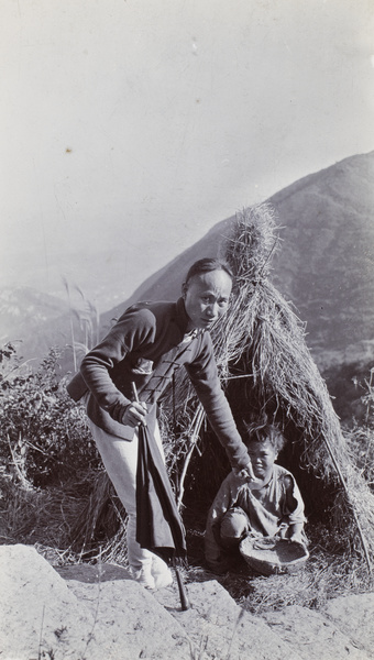 A pilgrim giving a coin to a beggar in a straw shelter