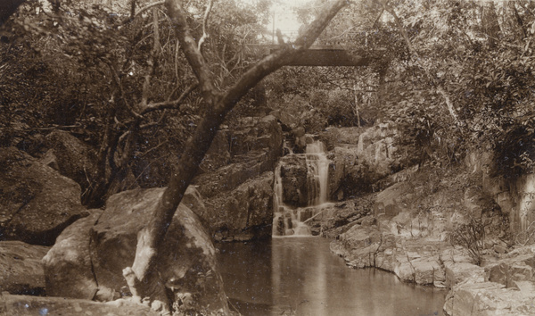 A waterfall, stream, and a bridge, Hong Kong